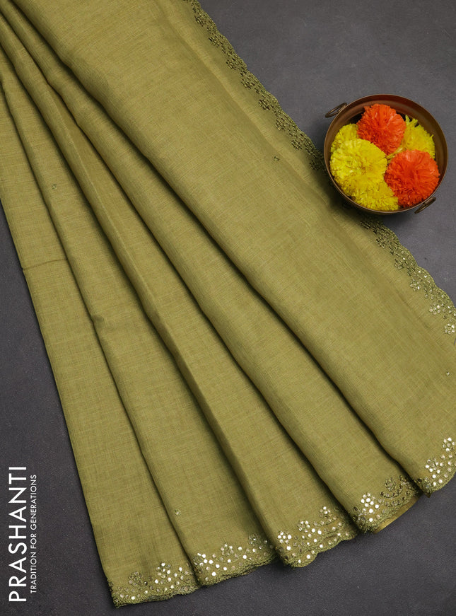 Art linen saree light green with embroidery mirror work buttas and convent embroidery pallu