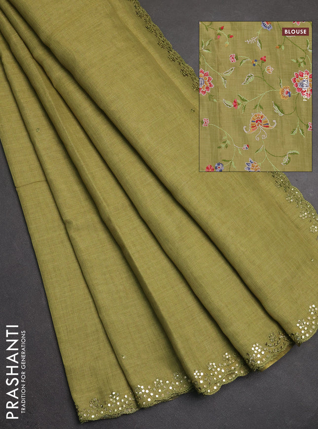 Art linen saree light green with embroidery mirror work buttas and convent embroidery pallu