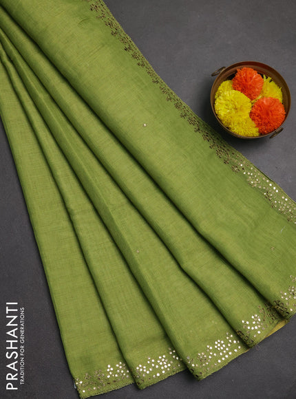 Art linen saree light green with embroidery mirror work buttas and convent embroidery pallu