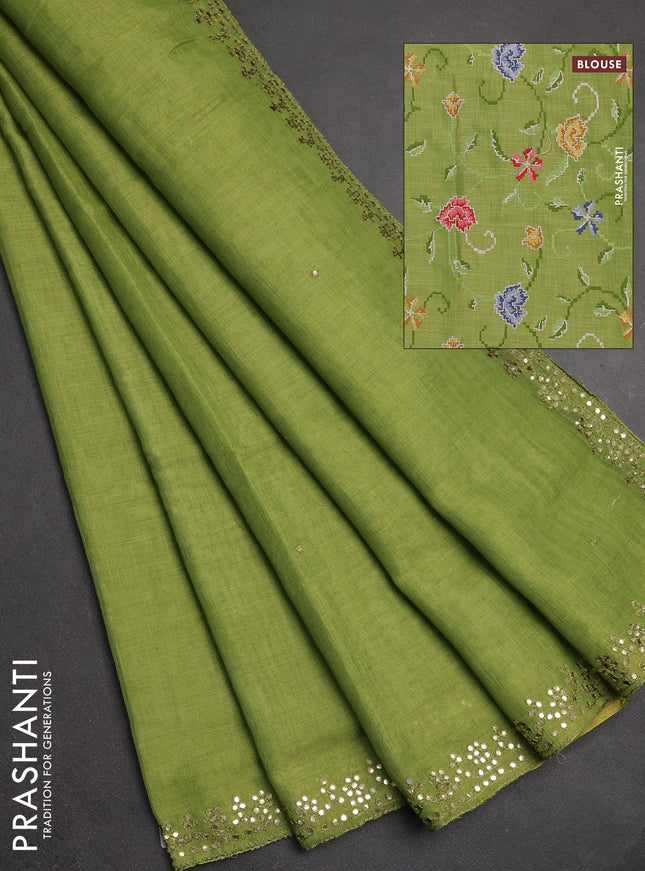 Art linen saree light green with embroidery mirror work buttas and convent embroidery pallu