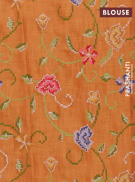 Art linen saree orange with embroidery mirror work buttas and convent embroidery pallu