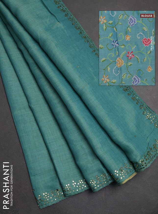 Art linen saree teal blue with embroidery mirror work buttas and convent embroidery pallu