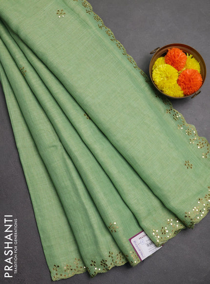 Art linen saree light green with embroidery mirror work buttas and convent embroidery pallu
