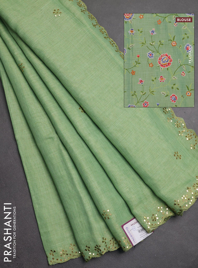 Art linen saree light green with embroidery mirror work buttas and convent embroidery pallu