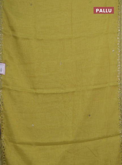 Art linen saree lime green with embroidery mirror work buttas and convent embroidery pallu