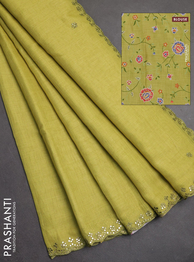 Art linen saree lime green with embroidery mirror work buttas and convent embroidery pallu