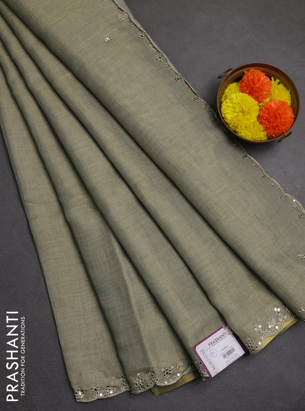 Art linen saree military green with embroidery mirror work buttas and convent embroidery pallu