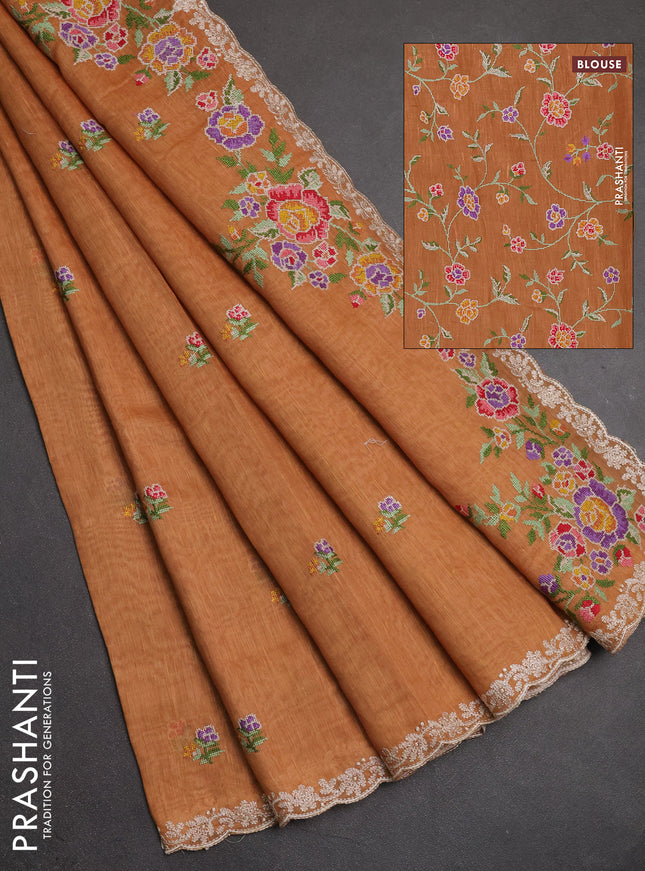 Art linen saree orange shade with allover convent embroidery buttas and embroidery border