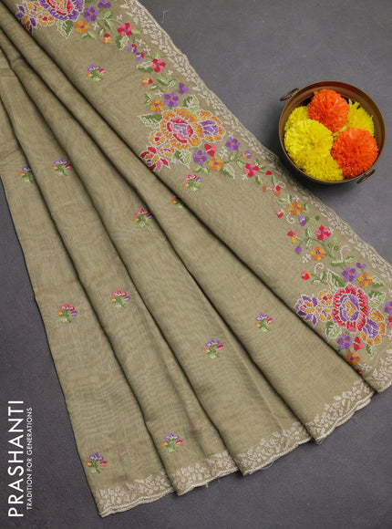 Art linen saree elaichi green with allover convent embroidery buttas and embroidery border