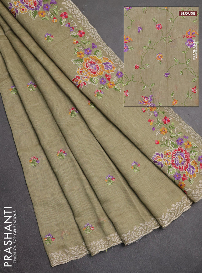 Art linen saree elaichi green with allover convent embroidery buttas and embroidery border