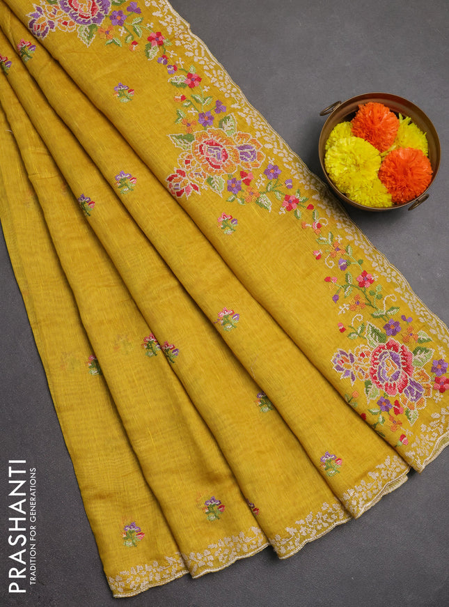Art linen saree mustard yellow with allover convent embroidery buttas and embroidery border