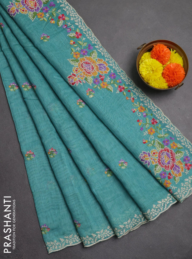 Art linen saree teal blue with allover convent embroidery buttas and embroidery border