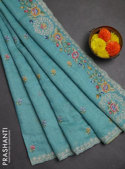 Art linen saree teal blue with allover convent embroidery buttas and embroidery border
