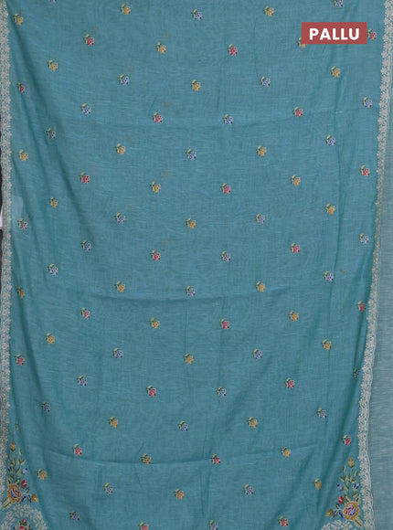 Art linen saree teal blue with allover convent embroidery buttas and embroidery border