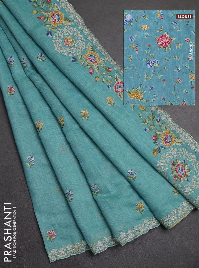 Art linen saree teal blue with allover convent embroidery buttas and embroidery border