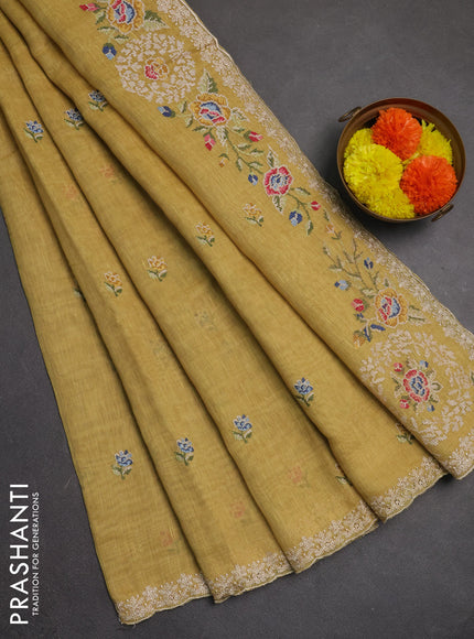 Art linen saree pale yellow with allover convent embroidery buttas and embroidery border