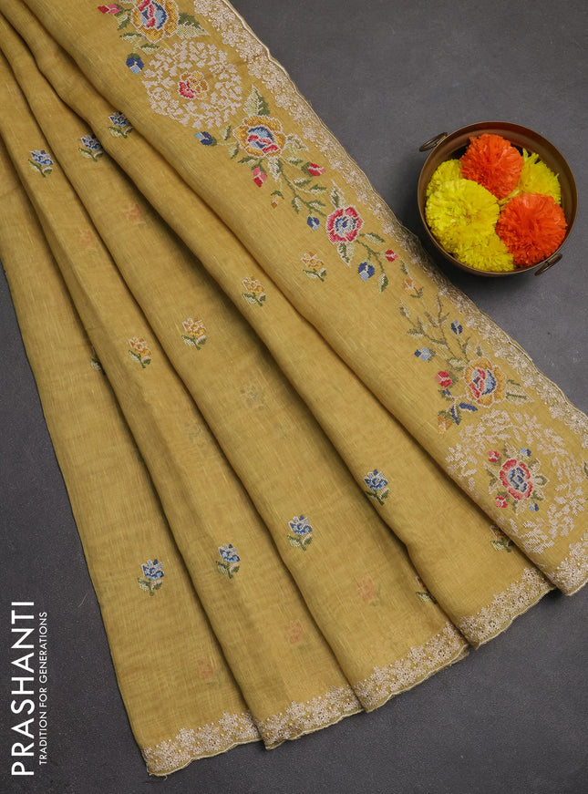 Art linen saree pale yellow with allover convent embroidery buttas and embroidery border