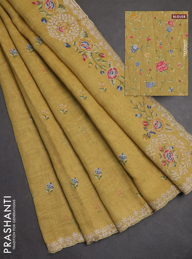 Art linen saree pale yellow with allover convent embroidery buttas and embroidery border