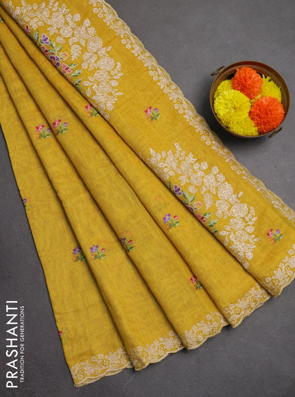 Art linen saree mustard yellow with allover convent embroidery buttas and embroidery border