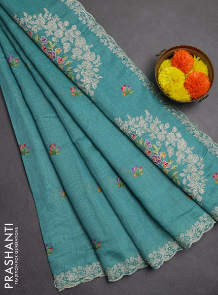 Art linen saree teal blue with allover convent embroidery buttas and embroidery border