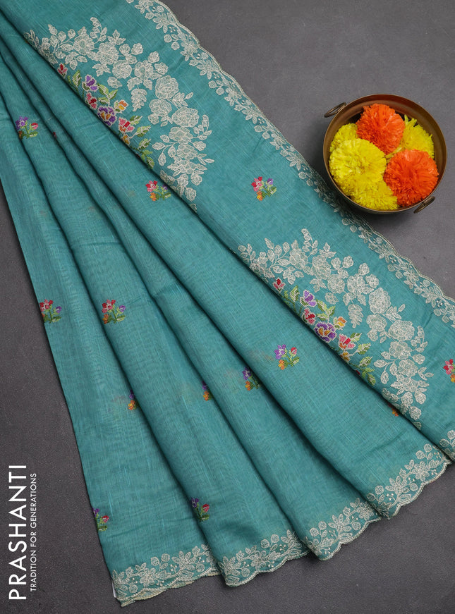 Art linen saree teal blue with allover convent embroidery buttas and embroidery border