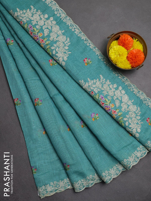 Art linen saree teal blue with allover convent embroidery buttas and embroidery border
