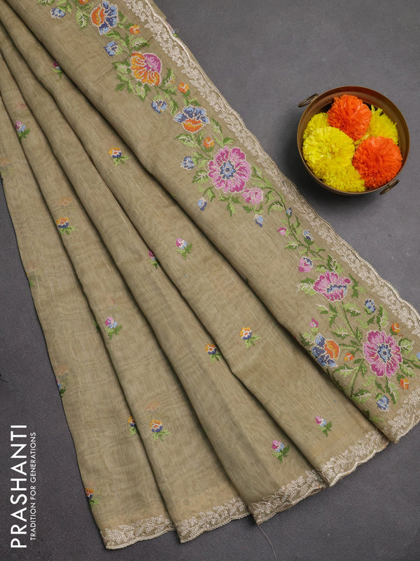 Art linen saree elaichi green with allover convent embroidery buttas and embroidery border