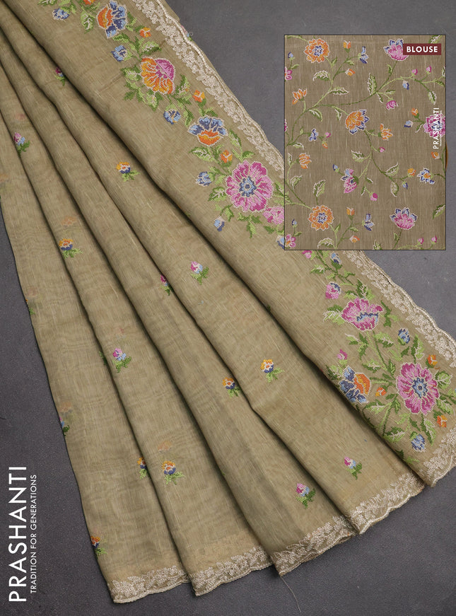 Art linen saree elaichi green with allover convent embroidery buttas and embroidery border