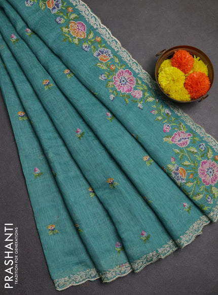 Art linen saree teal blue with allover convent embroidery buttas and embroidery border