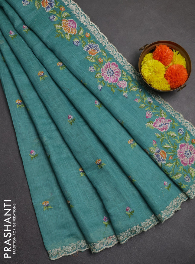 Art linen saree teal blue with allover convent embroidery buttas and embroidery border