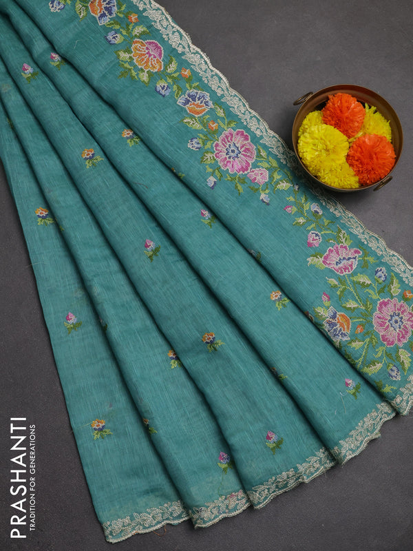 Art linen saree teal blue with allover convent embroidery buttas and embroidery border