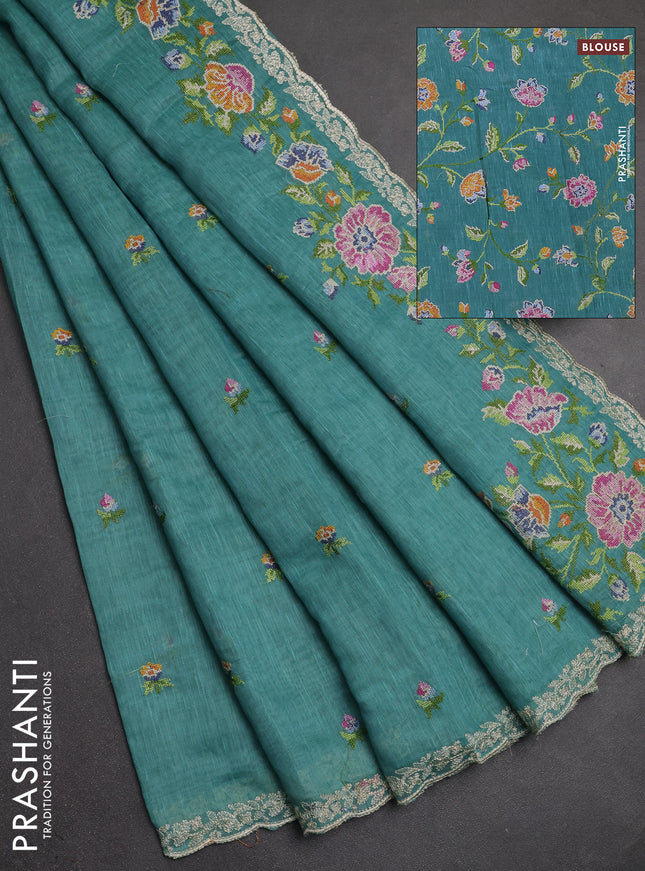Art linen saree teal blue with allover convent embroidery buttas and embroidery border