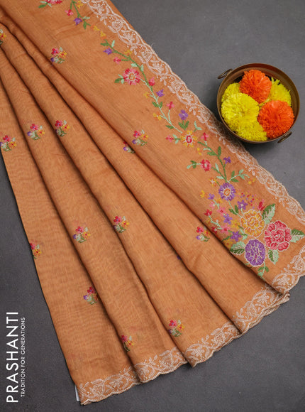 Art linen saree orange shade with allover convent embroidery buttas and embroidery border