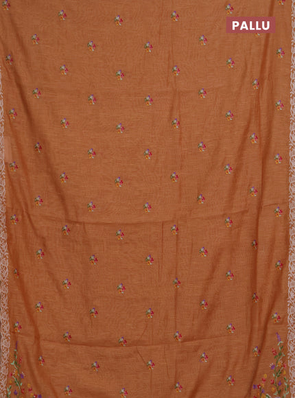 Art linen saree orange shade with allover convent embroidery buttas and embroidery border