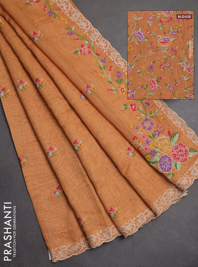 Art linen saree orange shade with allover convent embroidery buttas and embroidery border