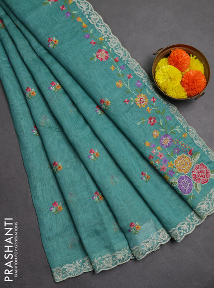 Art linen saree teal blue with allover convent embroidery buttas and embroidery border