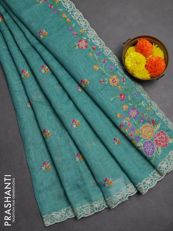 Art linen saree teal blue with allover convent embroidery buttas and embroidery border