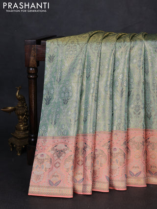 Pure kanchipuram tissue silk saree pastel blue and peach orange with allover zari woven brocade weaves and rich zari woven meenakari border