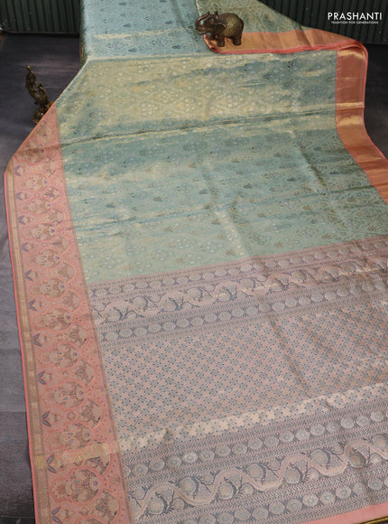 Pure kanchipuram tissue silk saree pastel blue and peach orange with allover zari woven brocade weaves and rich zari woven meenakari border