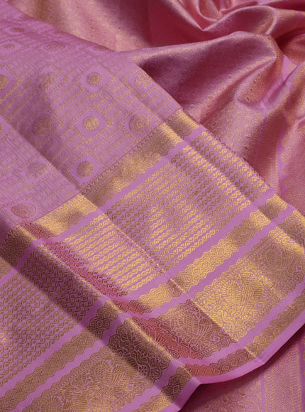 Pure kanchipuram silk saree lotus pink with allover zari woven brocade weaves and long rich zari woven border