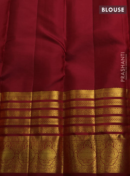 Pure kanchipuram silk saree maroon with allover zari woven brocade weaves and long rich zari woven border