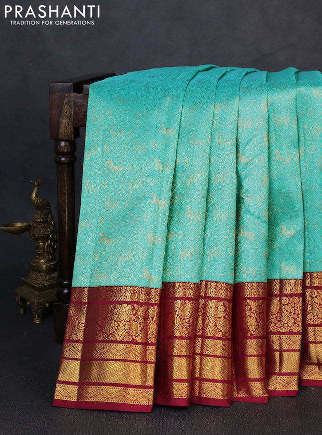 Pure kanchipuram silk saree teal blue and maroon with allover zari woven brocade weaves and long rich zari woven border