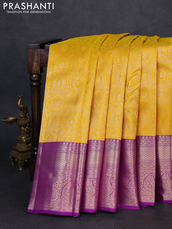 Pure kanchipuram silk saree yellow and purple with allover zari woven brocade weaves and long rich zari woven border