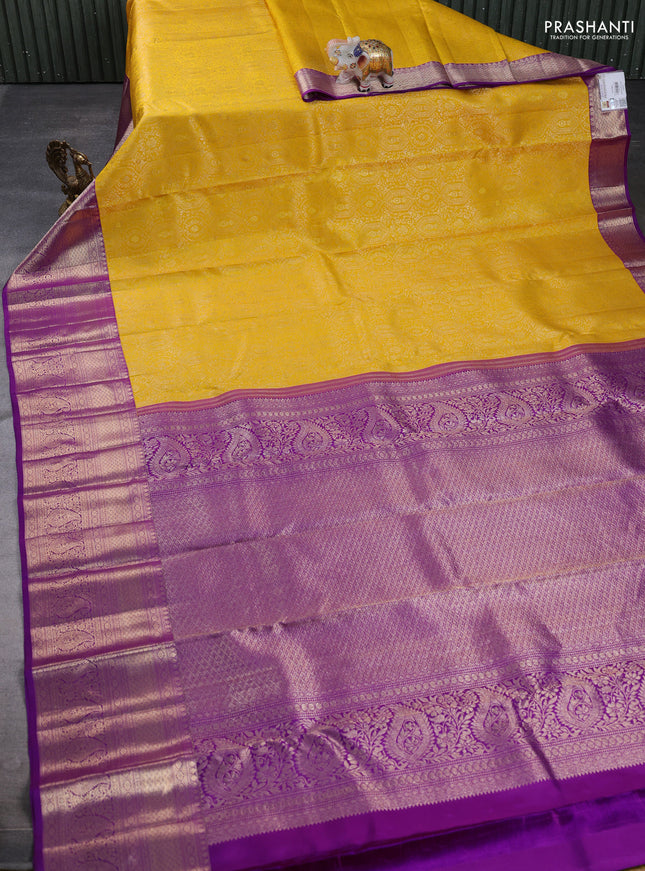 Pure kanchipuram silk saree yellow and purple with allover zari woven brocade weaves and long rich zari woven border