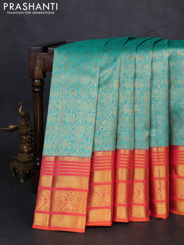 Pure kanchipuram silk saree teal green and sunset orange with allover zari woven brocade weaves and long rich zari woven border