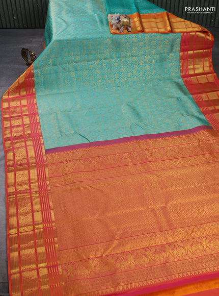Pure kanchipuram silk saree teal green and sunset orange with allover zari woven brocade weaves and long rich zari woven border