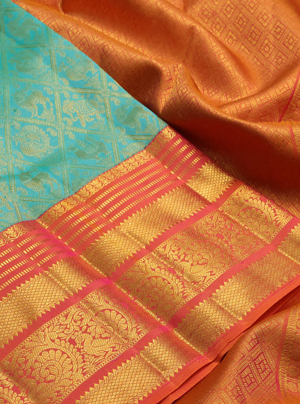 Pure kanchipuram silk saree teal green and sunset orange with allover zari woven brocade weaves and long rich zari woven border