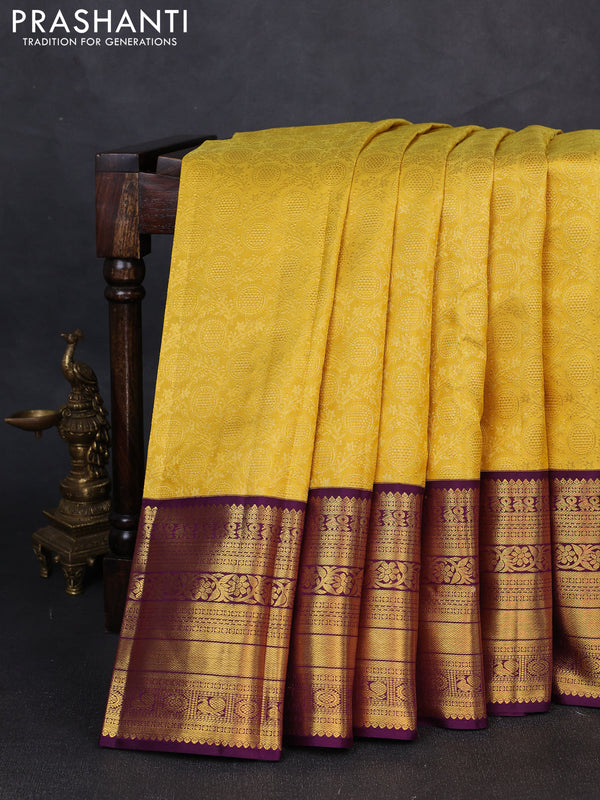 Pure kanchipuram silk saree yellow and deep purple with allover zari woven brocade weaves and long rich zari woven border