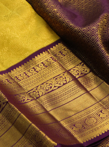 Pure kanchipuram silk saree yellow and deep purple with allover zari woven brocade weaves and long rich zari woven border