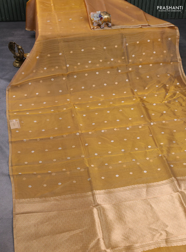 Banarasi tissue silk saree mustard yellow with allover silver & zari woven buttas and zari woven piping border
